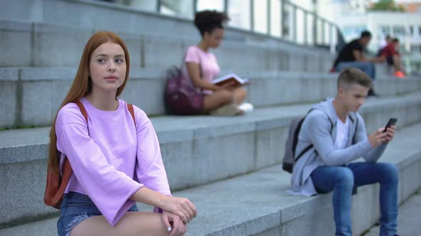 Sad Female Student Sitting Alone Campus Stairs, Unsociable Teenager Problems