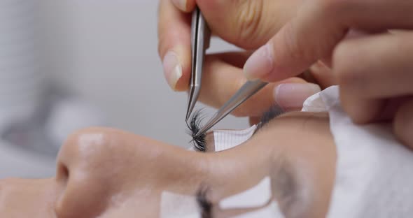 Beautiful young woman with eyelash extension