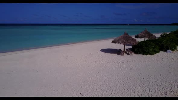 Aerial seascape of tranquil seashore beach lifestyle by clear ocean with clean sandy background of a