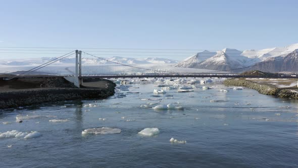 Flight Along the River Leading to Glacier Lagoon and Under the Bridge