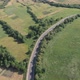 Drone filming of the Carpathian mountains in Ukraine. Cars are driving along the winding road - VideoHive Item for Sale
