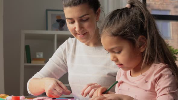 Daughter with Mother Making Applique at Home