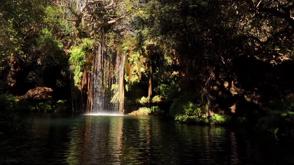 Footage of a small waterfall with a clear blue plunge pool in the Blyde River canyon Gorge on the Pa