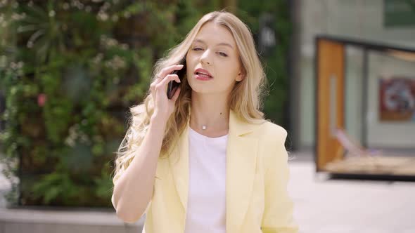 Young Woman Talking on Smartphone