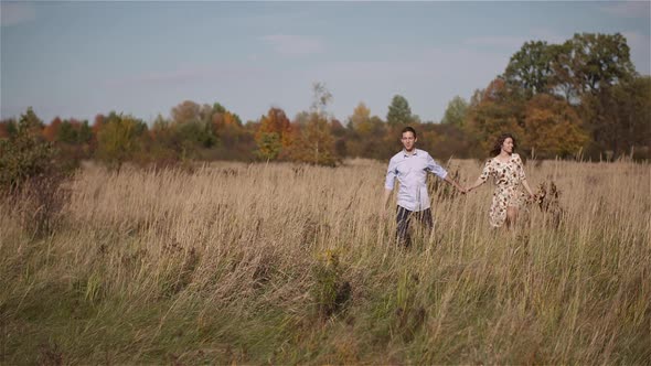 Couple in Love Walking and Holding Hands