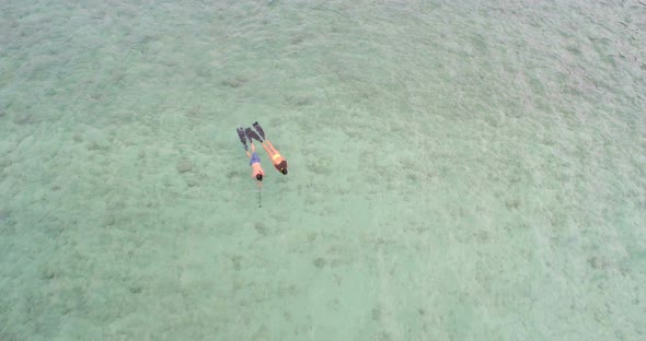 Couple snorkeling in the sea 4k