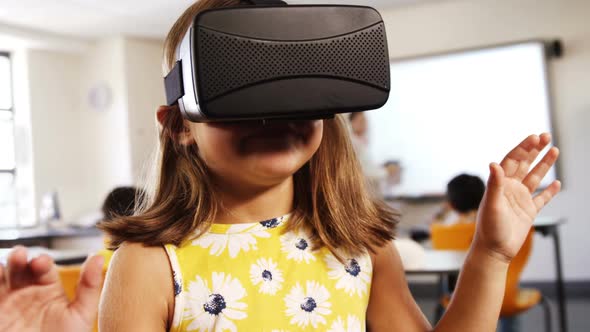 Girl using virtual reality headset in classroom