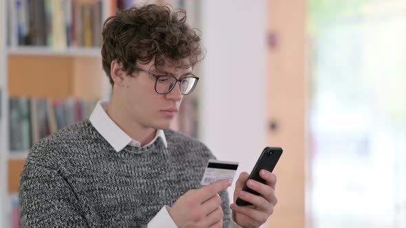 Portrait of Online Shopping on Smartphone By Young Man