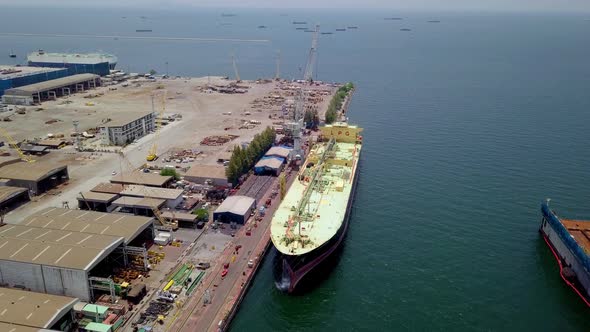 Aerial view of logistics concept of commercial vehicles, cars and pickup trucks waiting to be load o