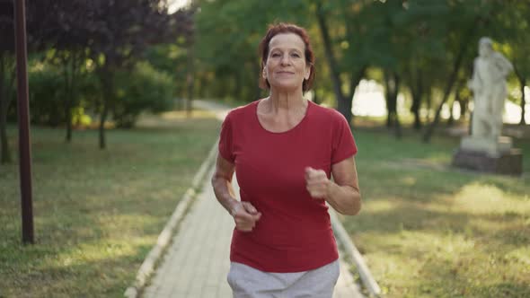 Woman Jogs at the Park