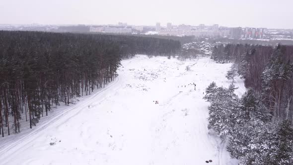 Aerial View Crowd of People on Recreational Activities in Valley at Winter Season