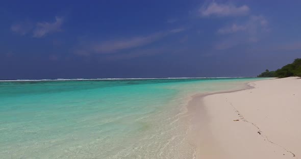 Natural flying copy space shot of a white sand paradise beach and blue ocean background in colorful 