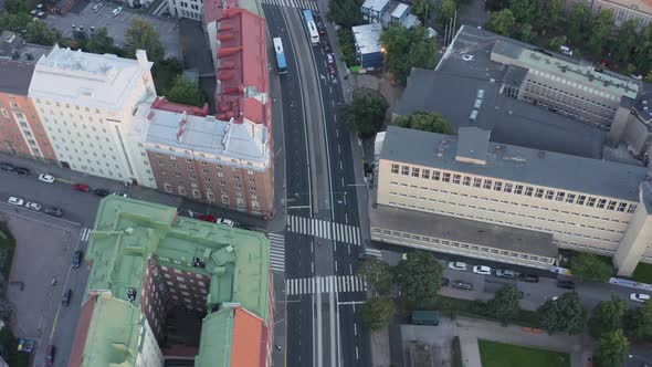 Aerial of Helsinki quiet street from above with buses and cars. Colorful