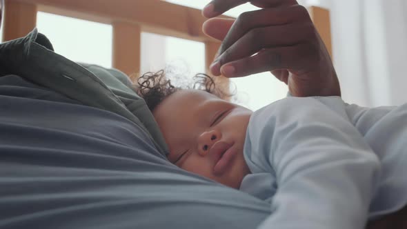 Sweet Baby Sleeping on His Dad