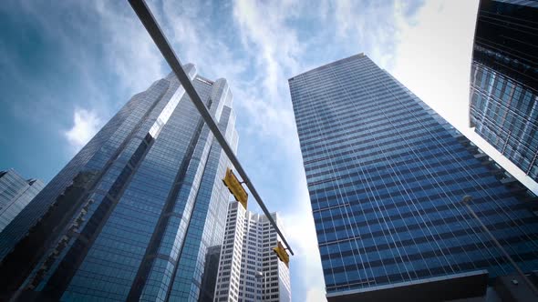 Wide shot of large towering skyscrapers in a futuristic city.