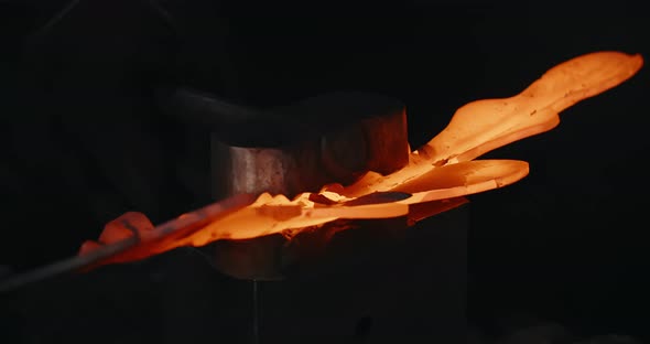 Blacksmith Makes a Grooved Surface for Decorative Redhot Forged Metal Product with Hydraulic Hammer