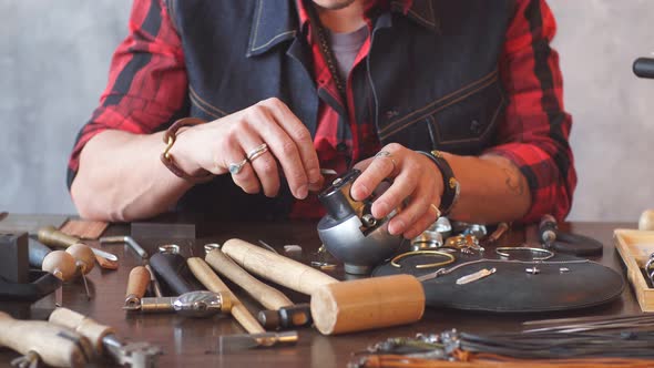 Craftsman Fixing a Jewel in Earring