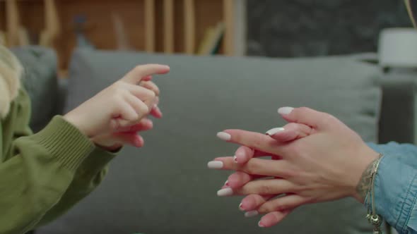 Hearing Impaired Mother and School Age Daughter Talking with Sign Language