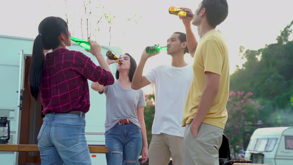 Group of Asian man and woman are having fun in new year party outdoor in the evening together.