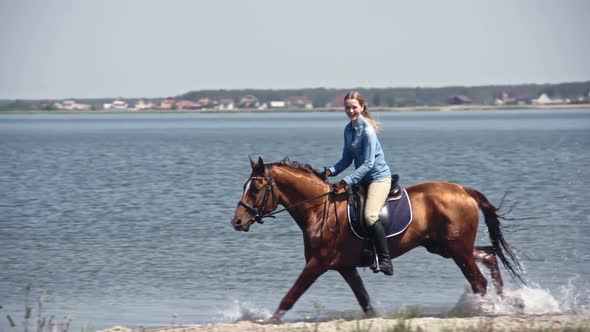 Laughing Female Rider in Cowboy Hat on Horseback