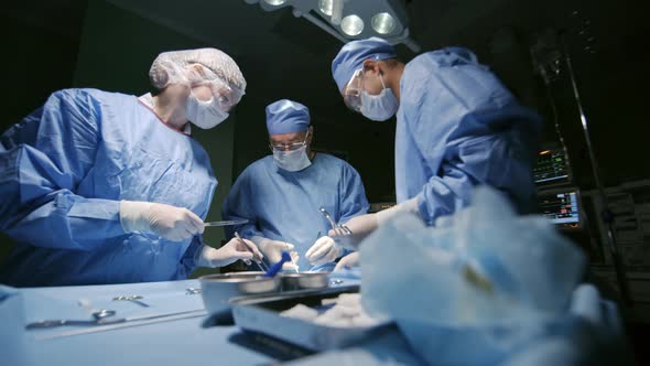 Surgical Doctors Operating on Patient