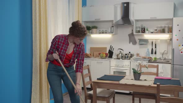 Woman Is Doing a Housework with a Mop