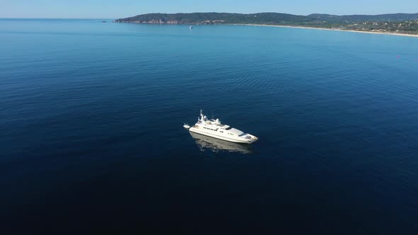 Aerial view of a yacht along the coast, Saint Tropez, France.