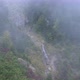 Waterfall in High Mountains in Fog Cloud in Rainy Weather - VideoHive Item for Sale
