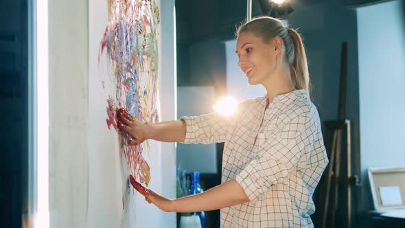 Blond Lady is Having an Arttherapy Session While Painting