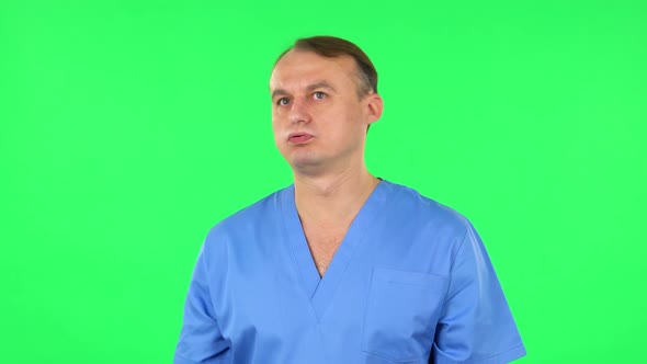 Medical Man Is Angry, Says Something and Sighs. Green Screen