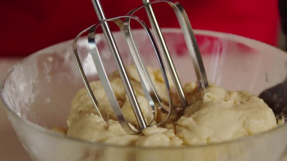 Cose Up View Baker Mixing Ingredients in Bowl Cooking Dough Baking Cake Using Electric Mixer