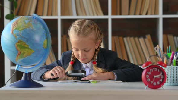 Young hispanic kid primary school student doing homework