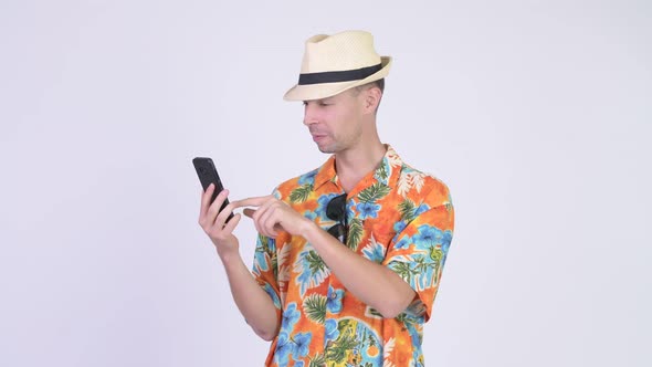Happy Tourist Man Using Phone and Giving Thumbs Up
