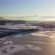 Aerial shot of a frozen mountain lake on a sunny winter day - VideoHive Item for Sale