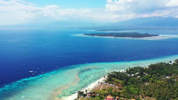 Aerial above texture of relaxing seashore beach journey by shallow lagoon with white sand background