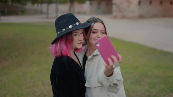 Beautiful Makeup Friends Taking Selfies with Smartphone on the Park