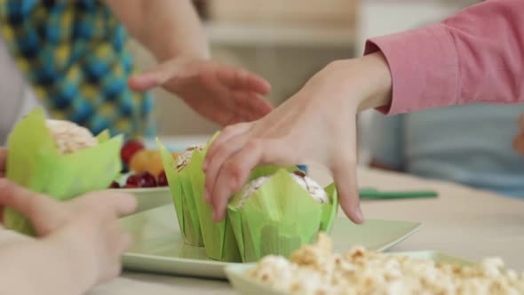 Child Hands Snatching Muffins