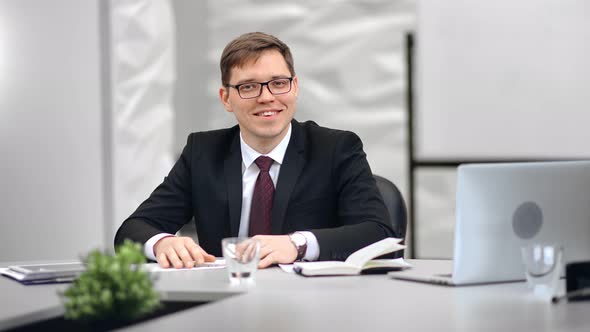 Stylish Young Office Worker in Glasses Posing at Workplace Medium Shot on Red Camera