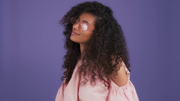 Darkskinned Woman in Sunglasses Colorful Blouse with Bare Shoulders