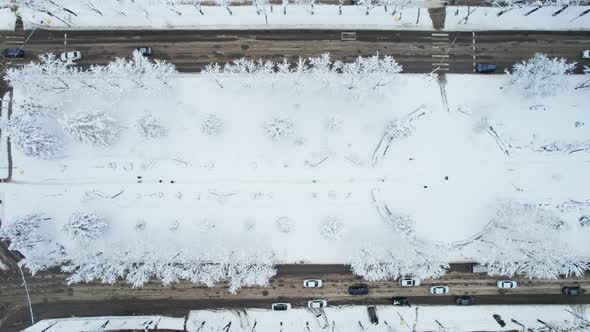 Aerial Top Down View of Snowy City Asphalt Road Landscapes in Winter