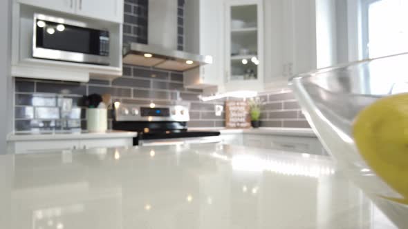 real estate slide past lemons on marble counter to show off high end stove smooth gimbal view