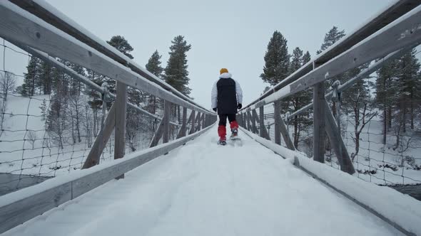 Young Hiking Man Walking Hanging Bridge National Park In Winter