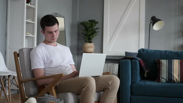 Man Sleeping while working on Laptop