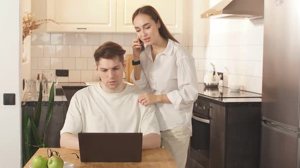 Wife Support Hardworking Man Working at Home.