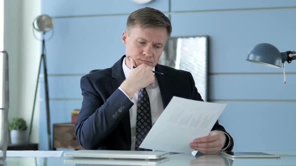 Businessman Reading Documents