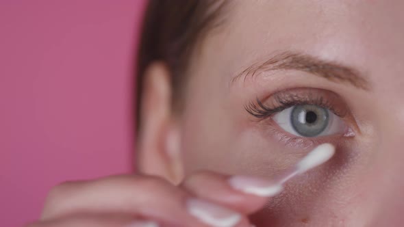 Close up of Woman Using Cotton Swab