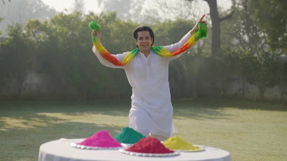 Indian man dancing at a Holi party