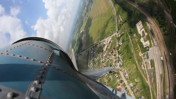 View From the Window of the Aircraft To the Green Fields. Plane Is Taking Off