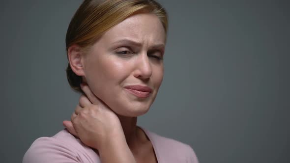 Lady Touching Neck Feeling Pain, Displacement of Cervical Vertebrae, Trauma