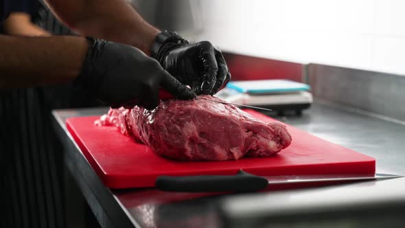 Butcher Cutting Meat